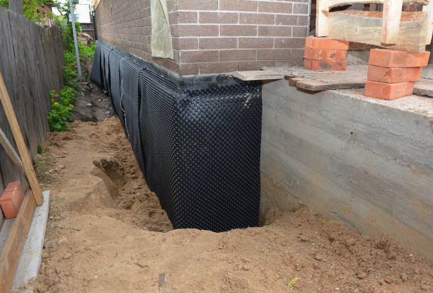 Happy homeowners after waterproofing job in Rushville